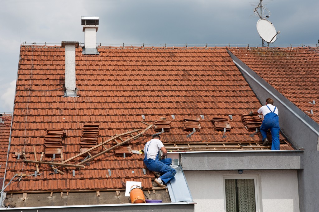 Two men working on the roof